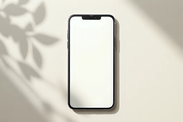 Mobile phone with blank screen mock up on a neutral beige linen background with aesthetic floral sunlight shadows. Flat lay, top view