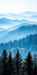 Obraz premium Majestic blue mountains rise under a misty sky with evergreen forests in the foreground