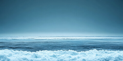 Fototapeta premium Calm ocean waters reflect soft blue hues under a serene sky during twilight hours