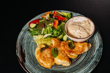 Schnitzel with vegetables and sauces