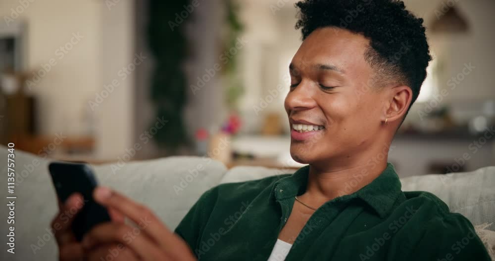 Poster man, phone and happy with texting on sofa in home with laugh, click and contact with online dating. 