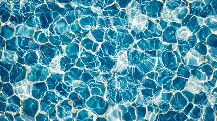 Rippled surface of clear blue water on a sunny day captures light beautifully