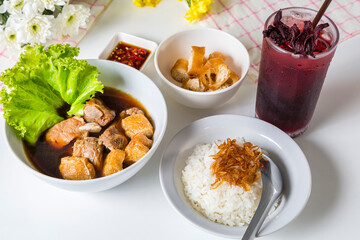Meal set of braised pork soup with rice and roselle juice on the wood table#7