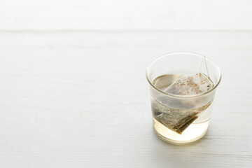 glass of hot tea and tea bag