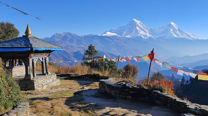 Obraz premium Scenic view of mountains and prayer flags beside a temple in the Himalayas