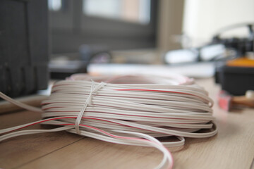 The thick white wire on floor 