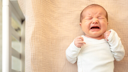 Newborn baby. Newborn baby girl crying.