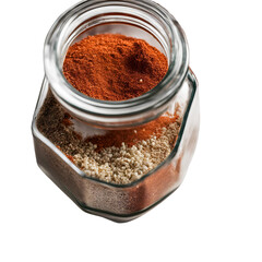 A jar of seasoning, featuring layers of salt, pepper, paprika, and garlic powder.