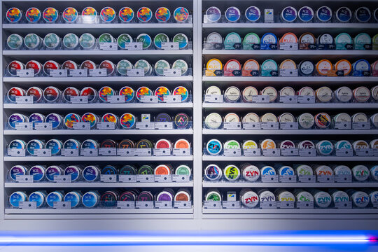 Stockholm, Sweden  Shelves filled with tins of smokeless tobacco pouches, or snus.