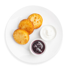 Cottage cheese pancakes with sour cream and jam, top view, on a white background, isolated.