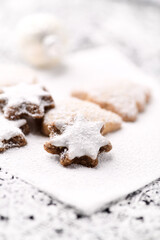 Christmas cookies (cinnamon stars) on bright background. Close up.