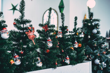 Merry x-mas,Close up of Colorful balls ,gifts box and Christmas greeting picture parcel,bell decoration on Green Christmas tree background Decoration During Christmas and New Year.