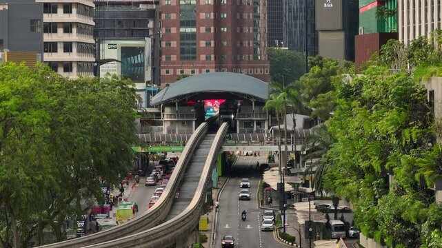 kuala lumpur city day time downtown mrt traffic street line station famous crossroad aerial panorama 4k malaysia