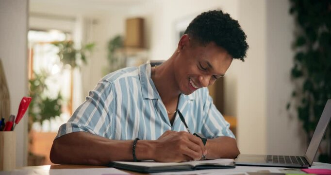 Journal, writing and man by table for planning life goals, achievement or manifestation. Happy, pictures and hands of male person with dream notebook for motivation, development or improvement.
