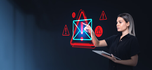 Woman interacting with holographic email alert warnings on dark
