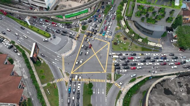 day time kuala lumpur city downtown area traffic mrt line street crossroad aerial topdown panorama 4k malaysia