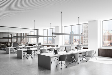 Modern open-space office interior with white desks and gray chairs, large windows with city view, minimalistic design, natural light. 3D Rendering