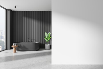Obraz premium Minimalist bathroom with dark bathtub and blank wall, modern interior design template. 3D Rendering