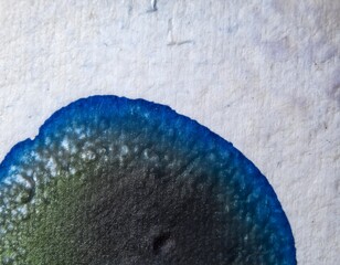 Close-up of Ink Blot on Textured Paper
