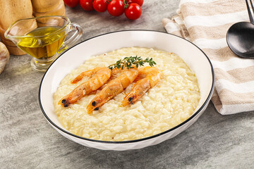 Italian risotto with prawn served thyme
