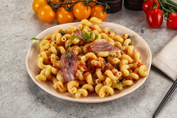 Italian pasta cellentani with anchovy