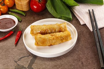 Vietnamese stuffed spring roll served sauce