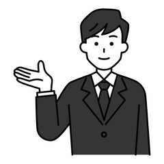 右手で案内する黒いスーツの男性