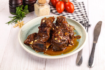 Prepared tasty beef ribs with sauce