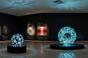 Modern art installation. A striking art installation featuring geometric designs and lighting effects in a gallery