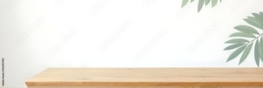 Poster a wooden table top is placed against a white wall with a subtle leaf pattern in the background._0000