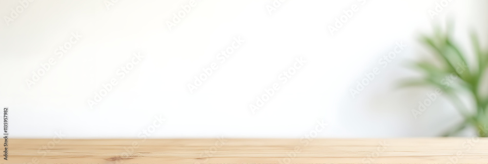 Poster a wooden table top is placed against a white wall with a subtle leaf pattern in the background._0000