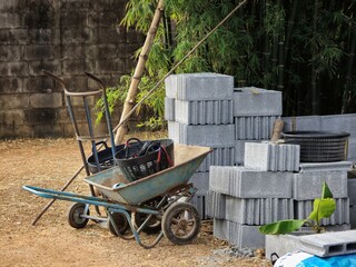 Fototapeta premium Wheelbarrow and Concrete Blocks