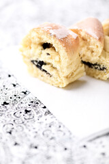 Close up of strudel with poppy seeds. Soft focus. Bright background.