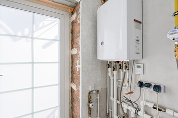 interior apartment room boiler room. heating system, pipes and appliances