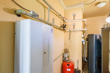 interior apartment room boiler room. heating system, pipes and appliances