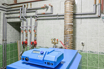 interior apartment room boiler room. heating system, pipes and appliances