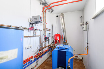 interior apartment room boiler room. heating system, pipes and appliances