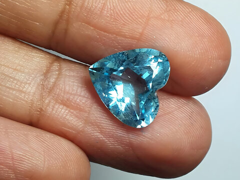 Heart-Shaped Blue Topaz Gemstone on Finger