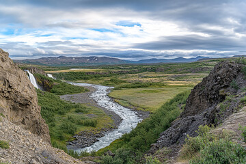 A breathtakingly beautiful view of the majestic waterfall at Broparfoss, Iceland