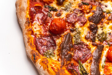 Homemade freshly baked pepperoni pizza on a white background. Close-up, chosen focus.