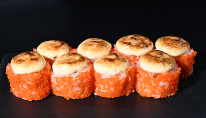 Japanese sushi on a black stand. View from above