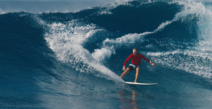 Pro surfer rides big wave in the Maldives