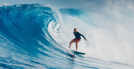 Pro surfer rides big wave in the Maldives