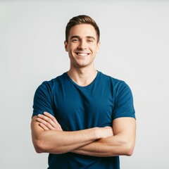 Fototapeta premium A man wearing a blue t-shirt with crossed arms, studio shot, isolated on a white background.