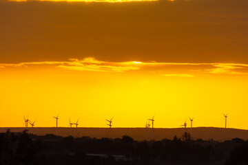 sunset behind the wind turbines in the Essaouira region in Morocco