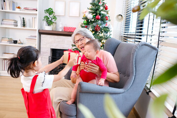 Young girl and old woman celebrating Christmas. Christmas concept..