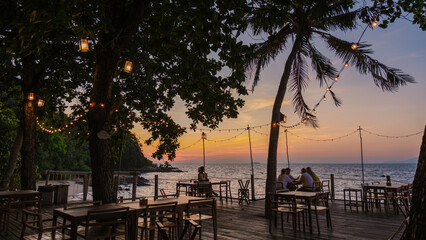 Tranquil evening at Koh Munnork Island with sunset views and cozy seating