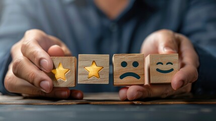 A person holding wooden blocks with happy and sad faces