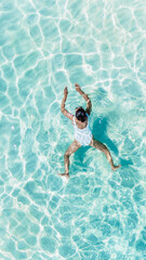 Refreshing swim in the crystal clear waters of Koh Munnork Island in Rayong Thailand