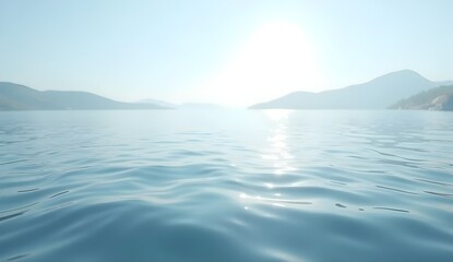 Naklejka premium A calm sea with a clear blue sky and distant mountains.